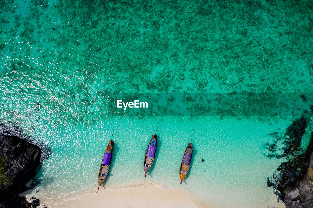 High angle view of long trail boat and tourist on the beach kra bi thailand 