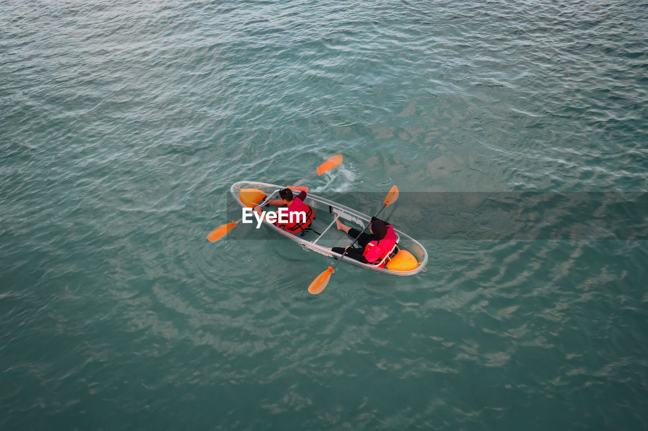 high angle view of man kayaking in sea