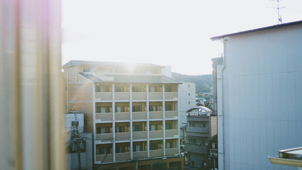 EXTERIOR OF RESIDENTIAL BUILDINGS AGAINST SKY