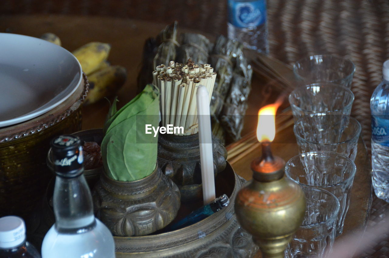 High angle view of diya with weed on table