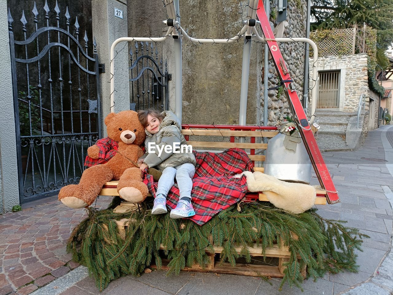 Portrait of woman sitting on swing