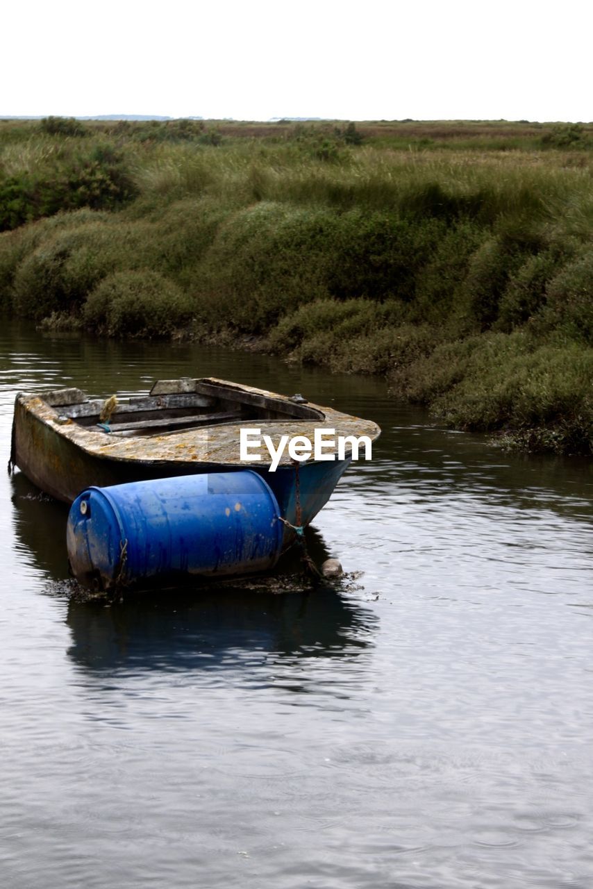 BOATS SAILING IN RIVER