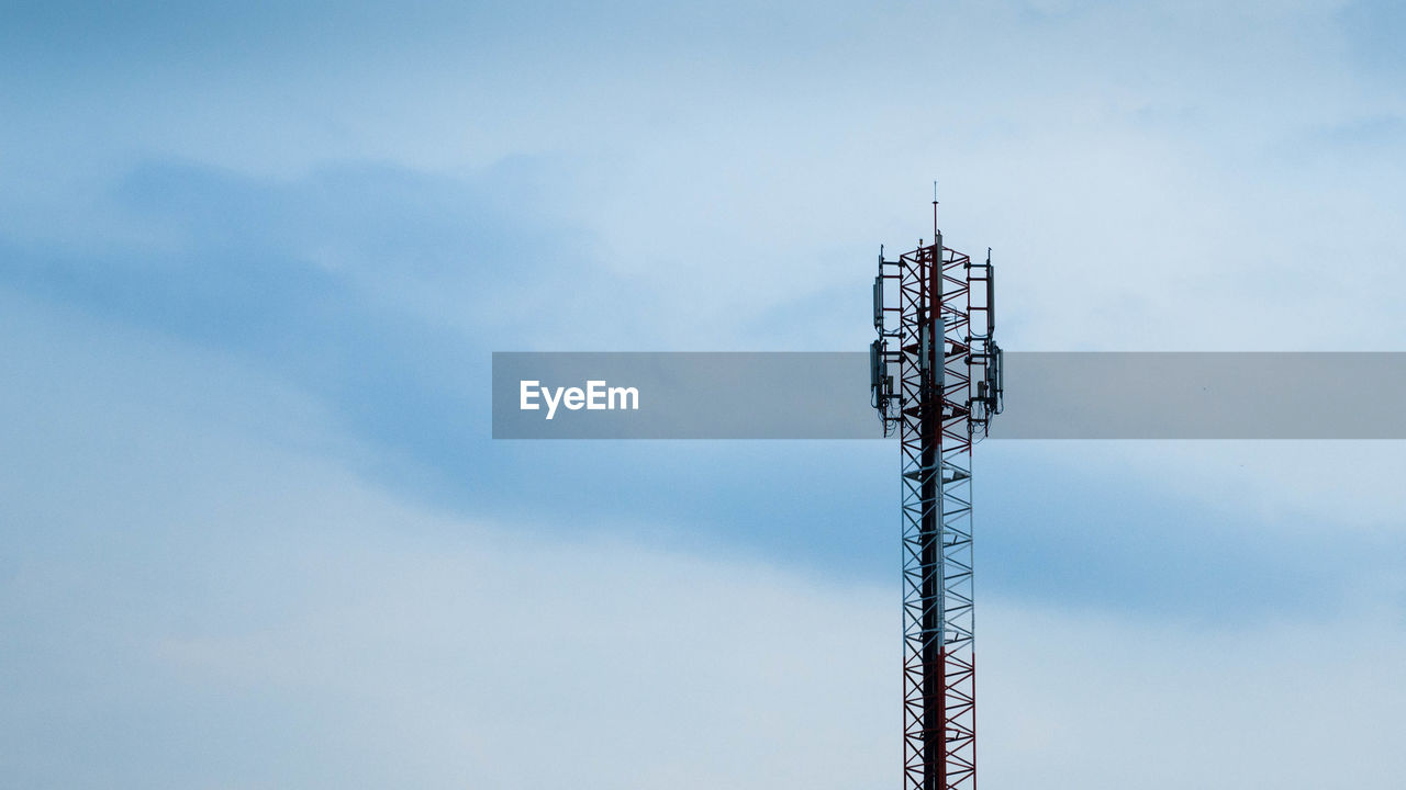 Low angle view of communications tower against sky