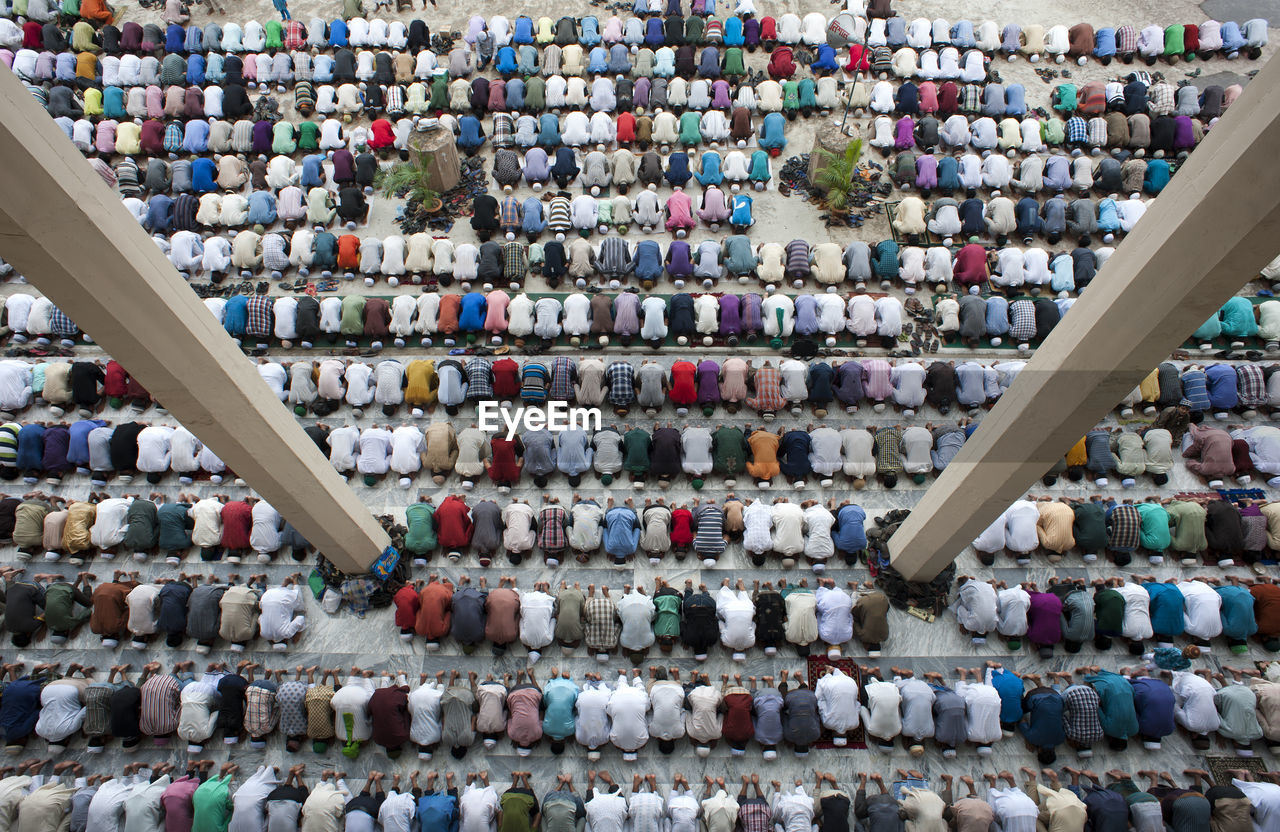 Large group of muslim people praying