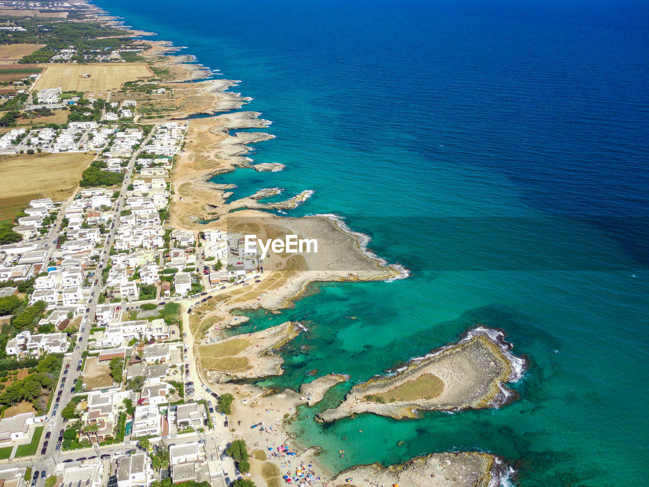 HIGH ANGLE VIEW OF BEACH AND BUILDINGS