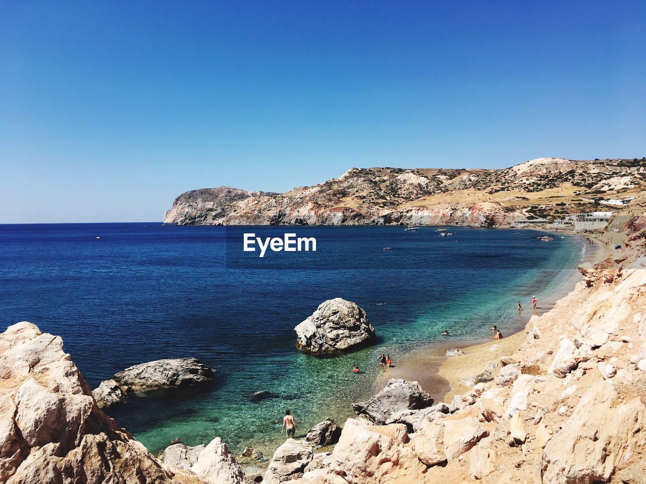 Scenic view of sea against clear blue sky