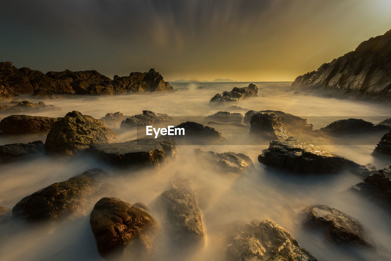 Panoramic view of sea against sky during sunset