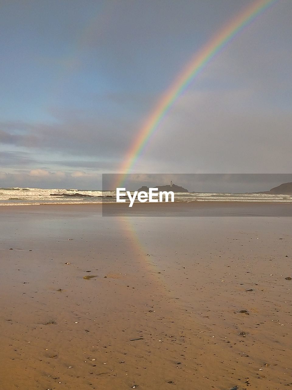 SCENIC VIEW OF RAINBOW OVER BEACH