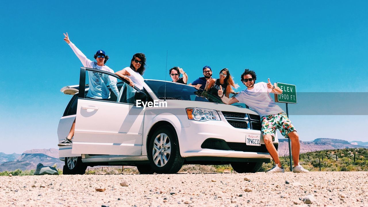 GROUP OF PEOPLE ON THE ROAD