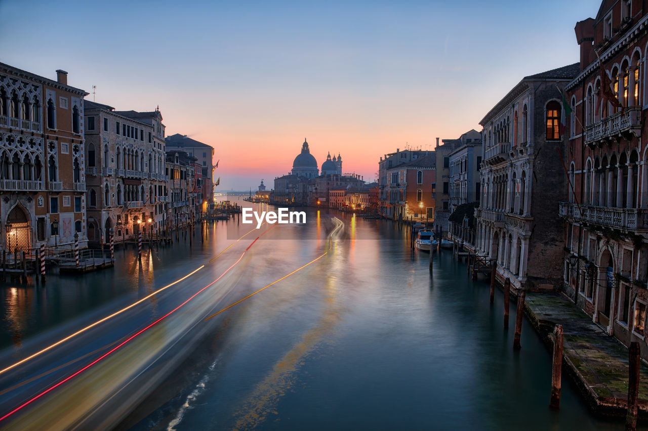 VIEW OF BUILDINGS AT SUNSET