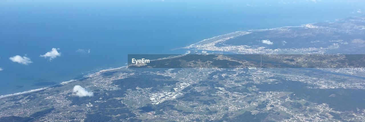 Aerial view of snowcapped mountain against sky