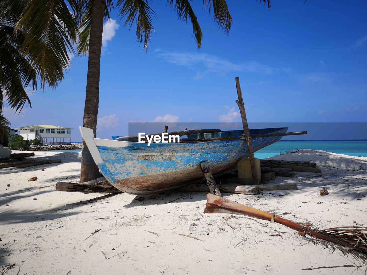 BOAT ON BEACH AGAINST SKY