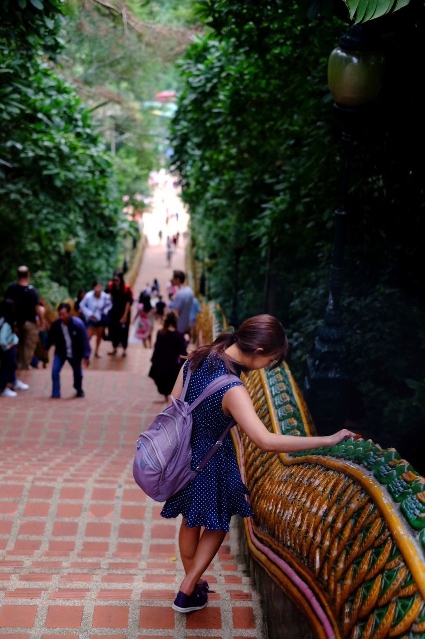 Side view of woman on steps