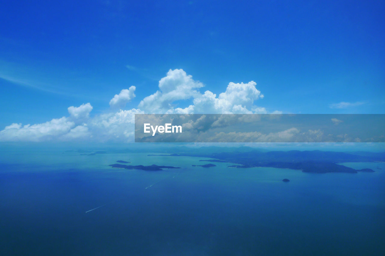 Scenic view of sea against blue sky