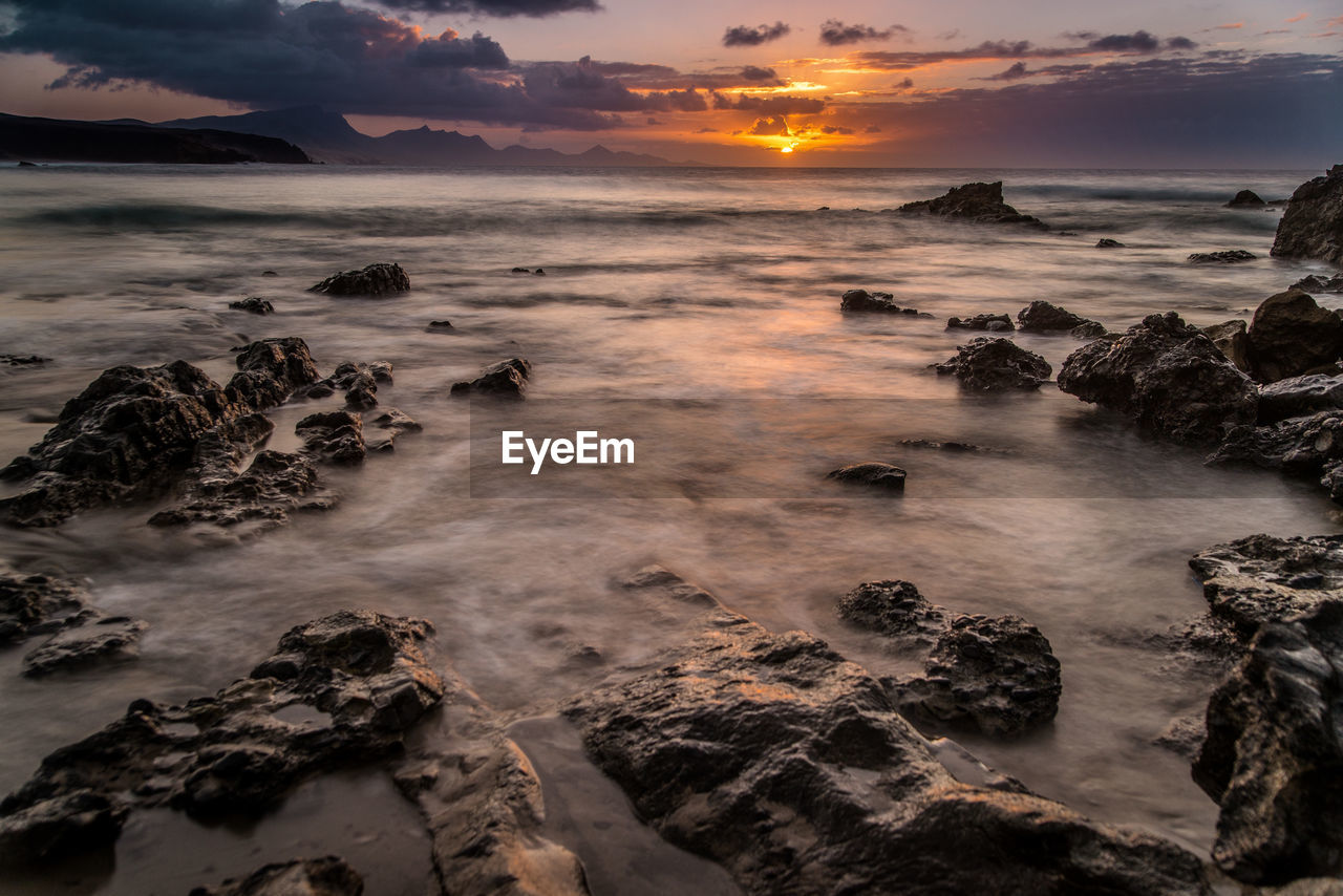 SCENIC VIEW OF SEA DURING SUNSET