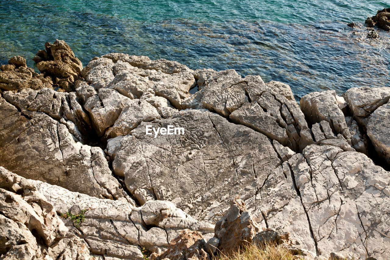 Detail of rock surface washed by the sea for ages. coast line of losinj island, croatia.