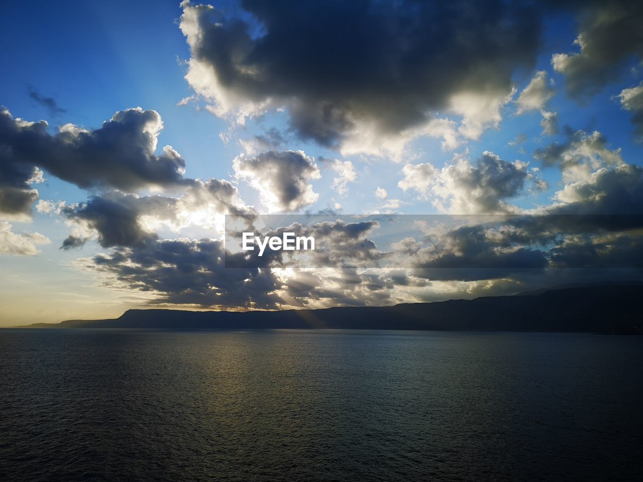 SCENIC VIEW OF SEA AGAINST SUNSET SKY