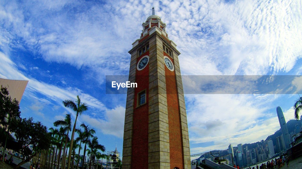 Low angle view of clock tower against sky