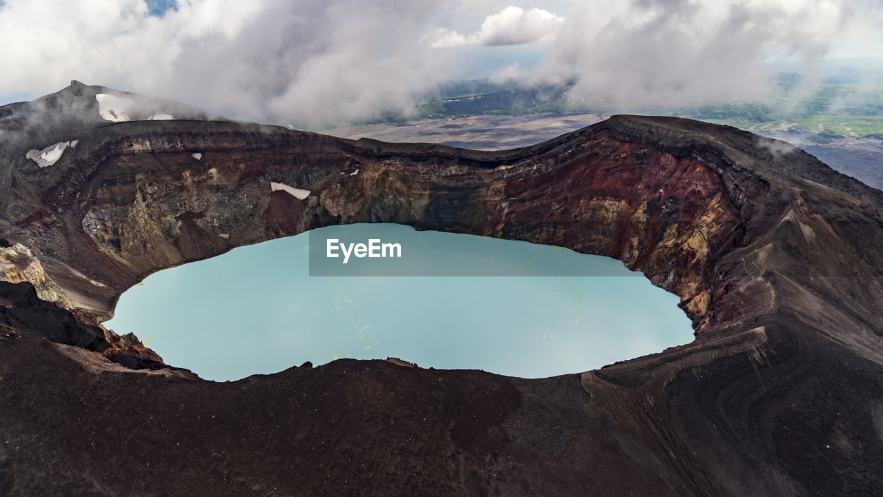 Kamchatka. maly semyachik volcano crater with acid lake