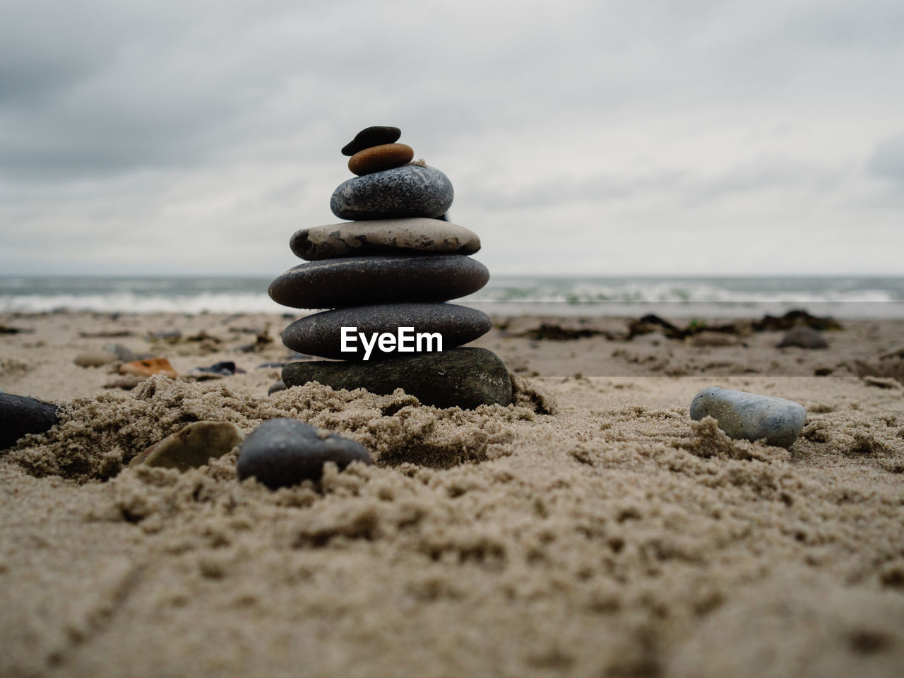 STACK OF PEBBLES ON BEACH