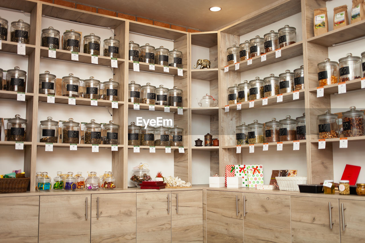 Tea shop, counter. natural dry drink in glass jars.