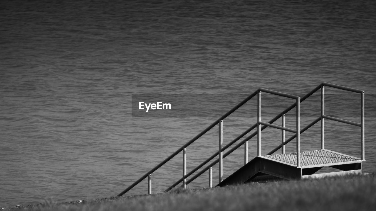 High angle view of staircase by sea