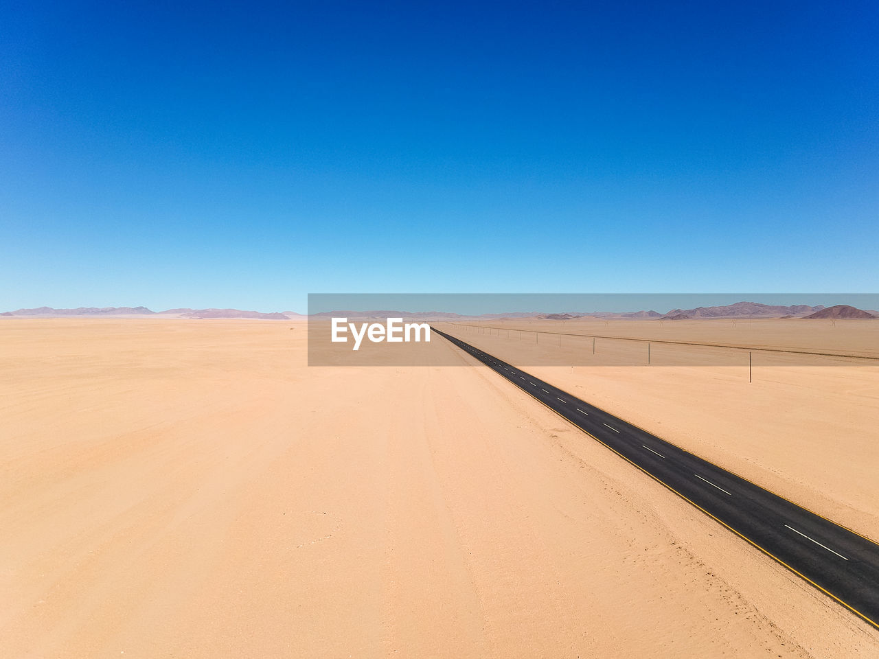 Drone - straight b4 desert road and train line between lüderitz and keetmanshoop in namibia, africa.