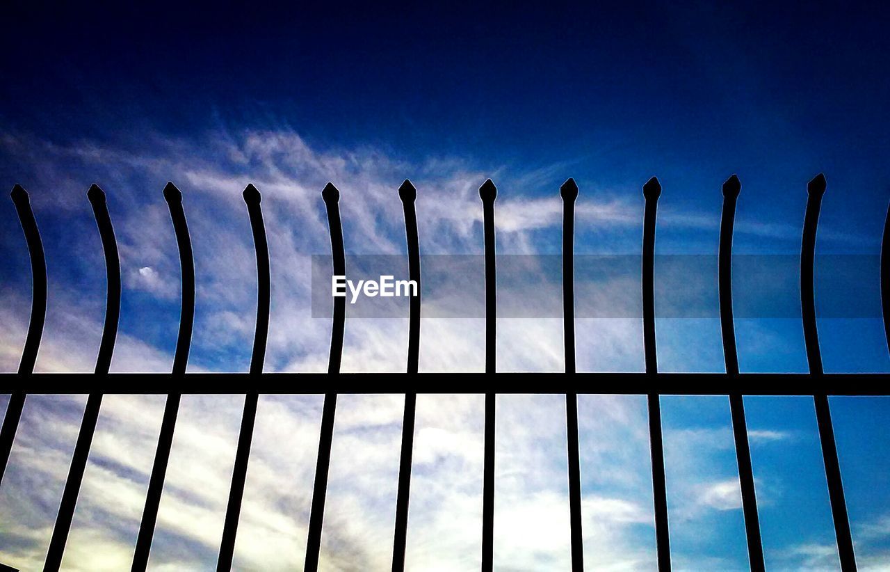LOW ANGLE VIEW OF FENCE AGAINST SKY