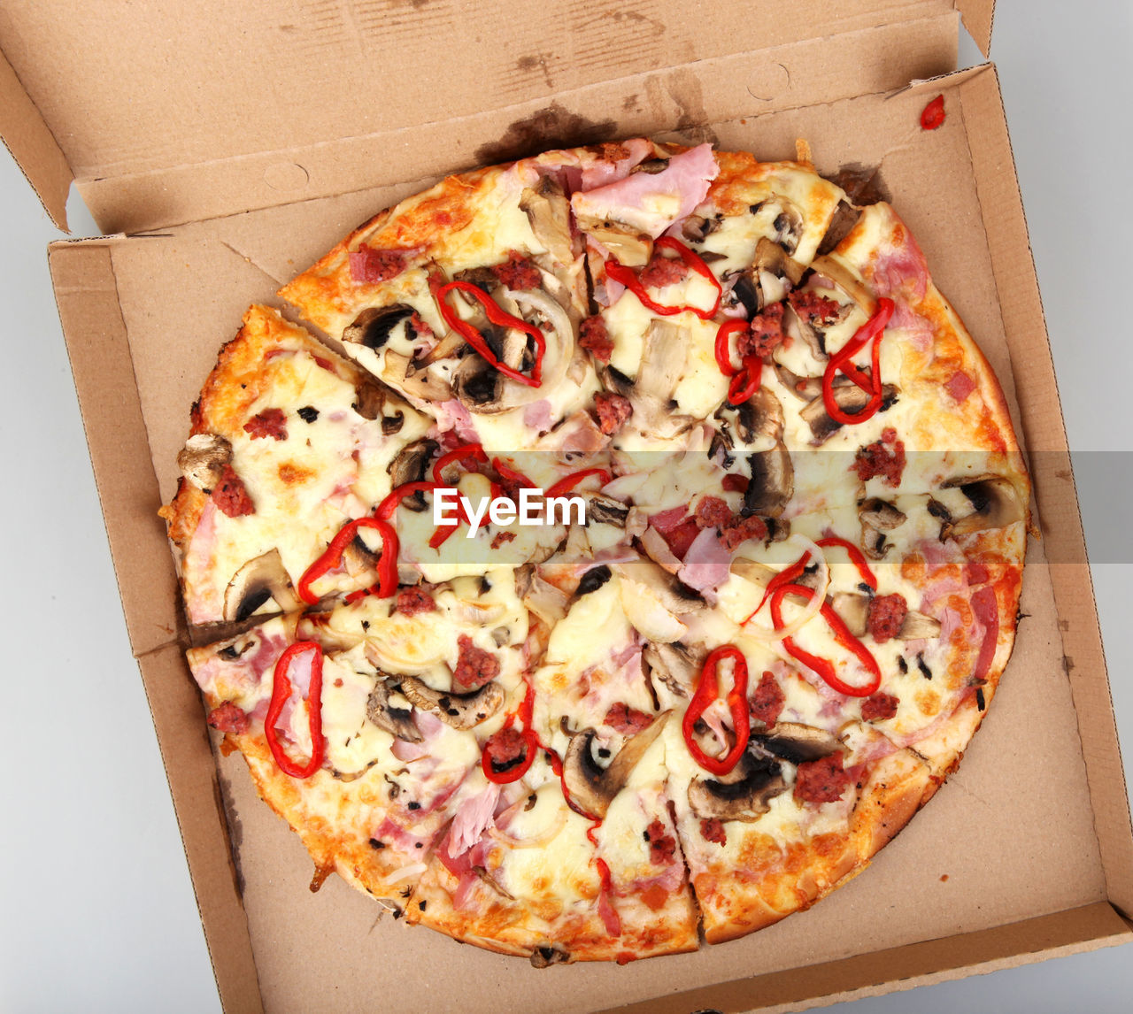 CLOSE-UP OF PIZZA IN CONTAINER