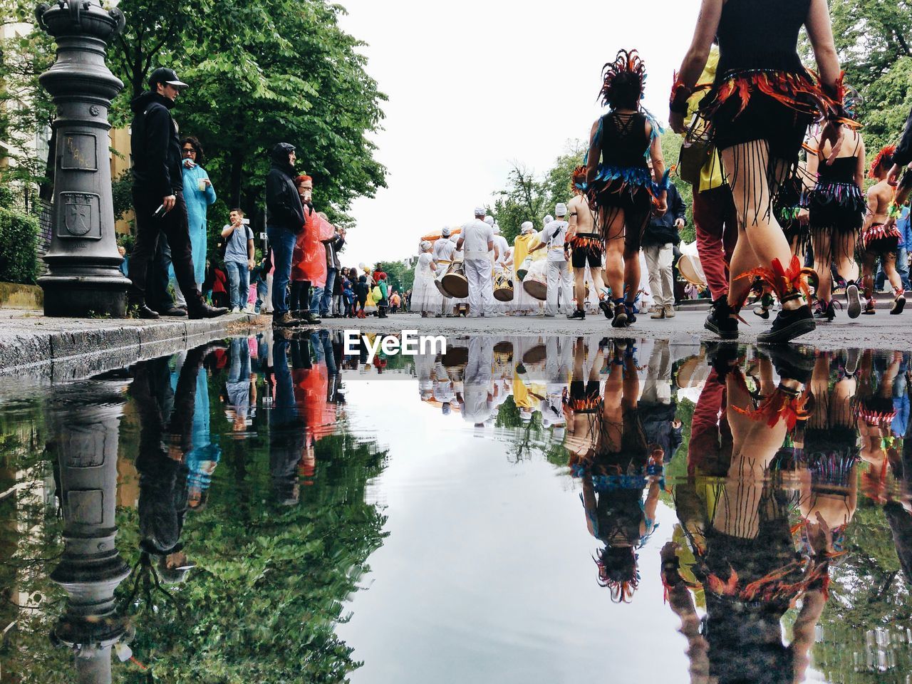 REFLECTION OF PEOPLE ON WATER