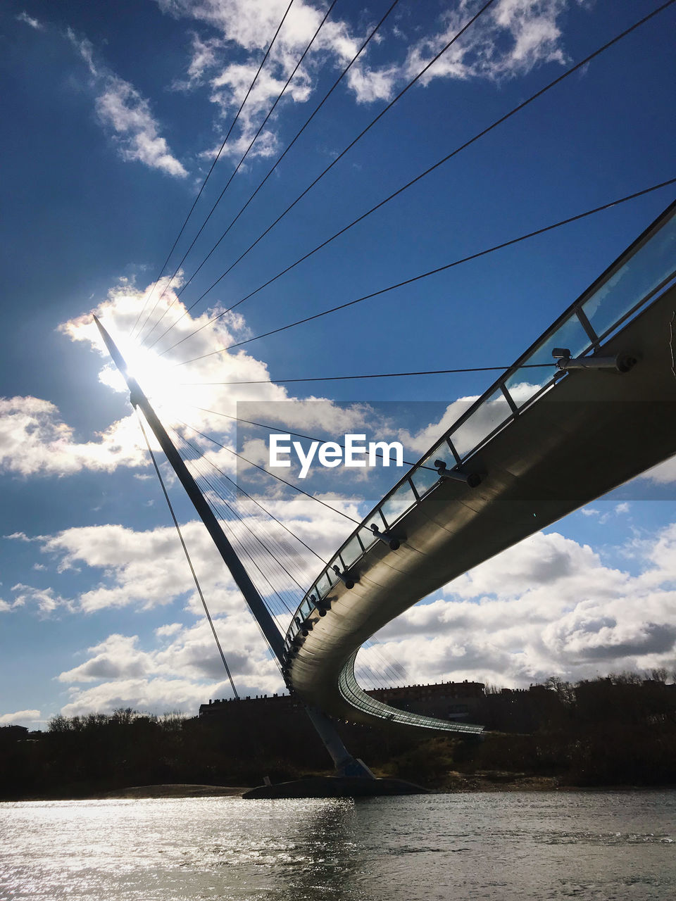 Curved pedestrian bridge over the river ebro in zaragoza