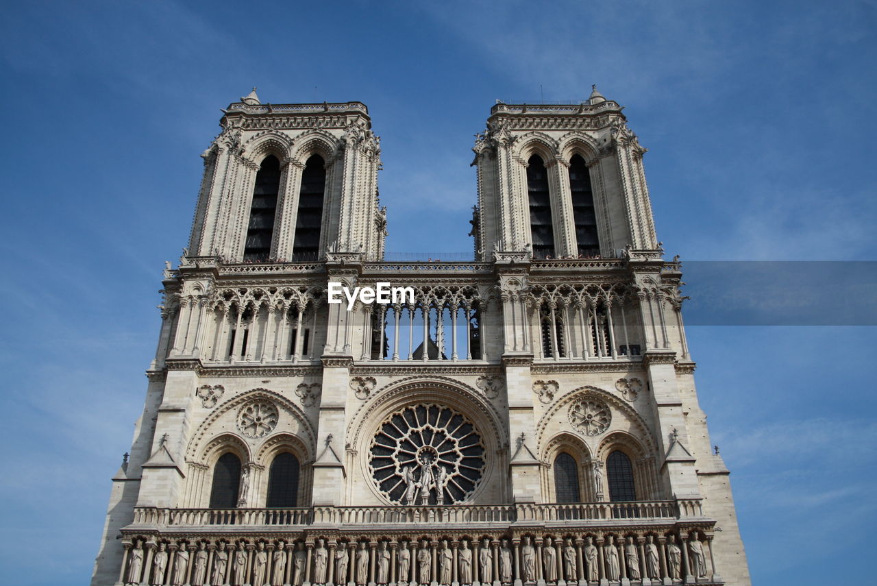 Low angle view of cathedral against sky, notredame