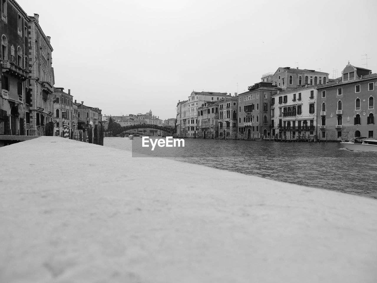 TOWN IN RIVER WITH CITY IN BACKGROUND