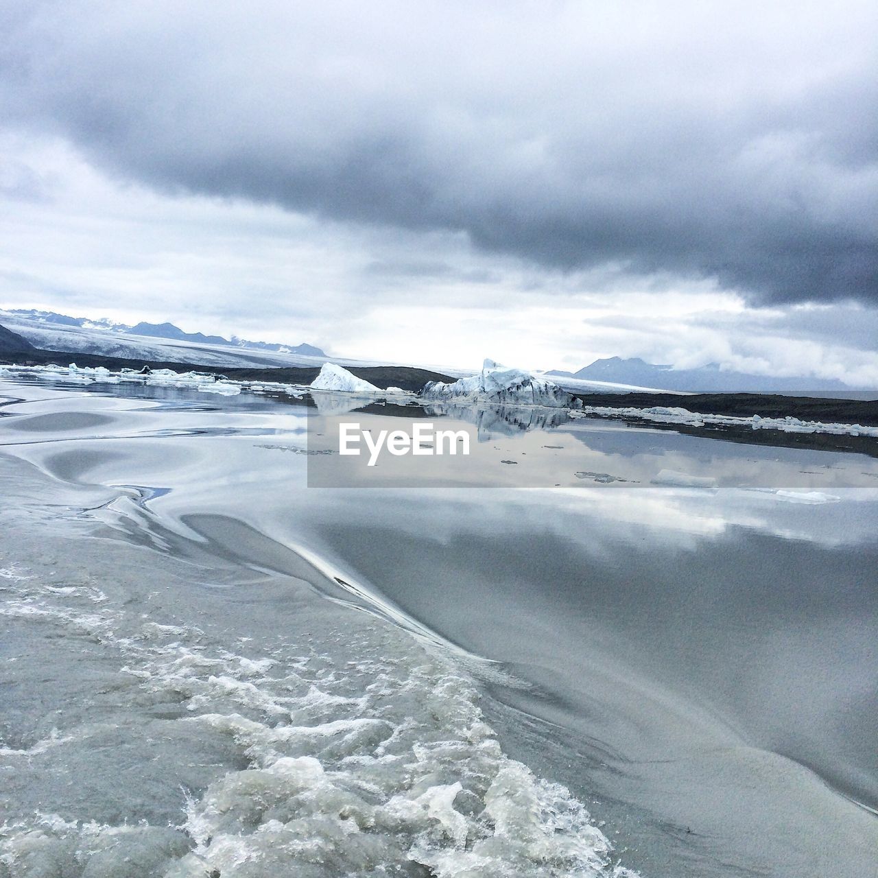 Scenic view of frozen lake against sky