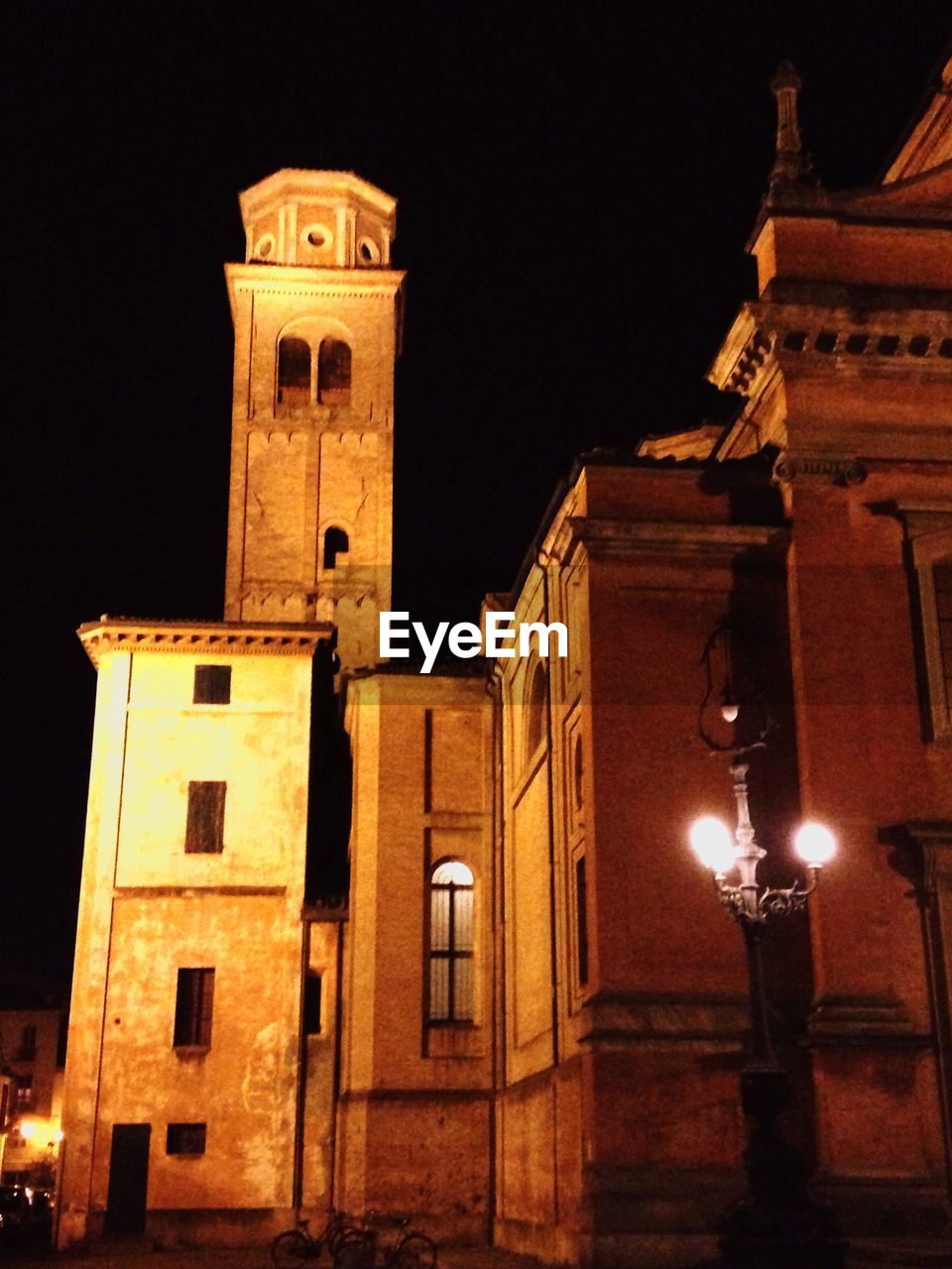 LOW ANGLE VIEW OF ILLUMINATED BUILDING