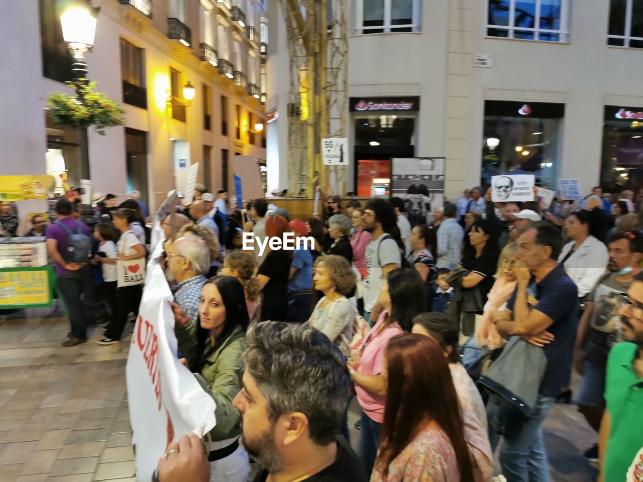 GROUP OF PEOPLE WALKING ON STREET