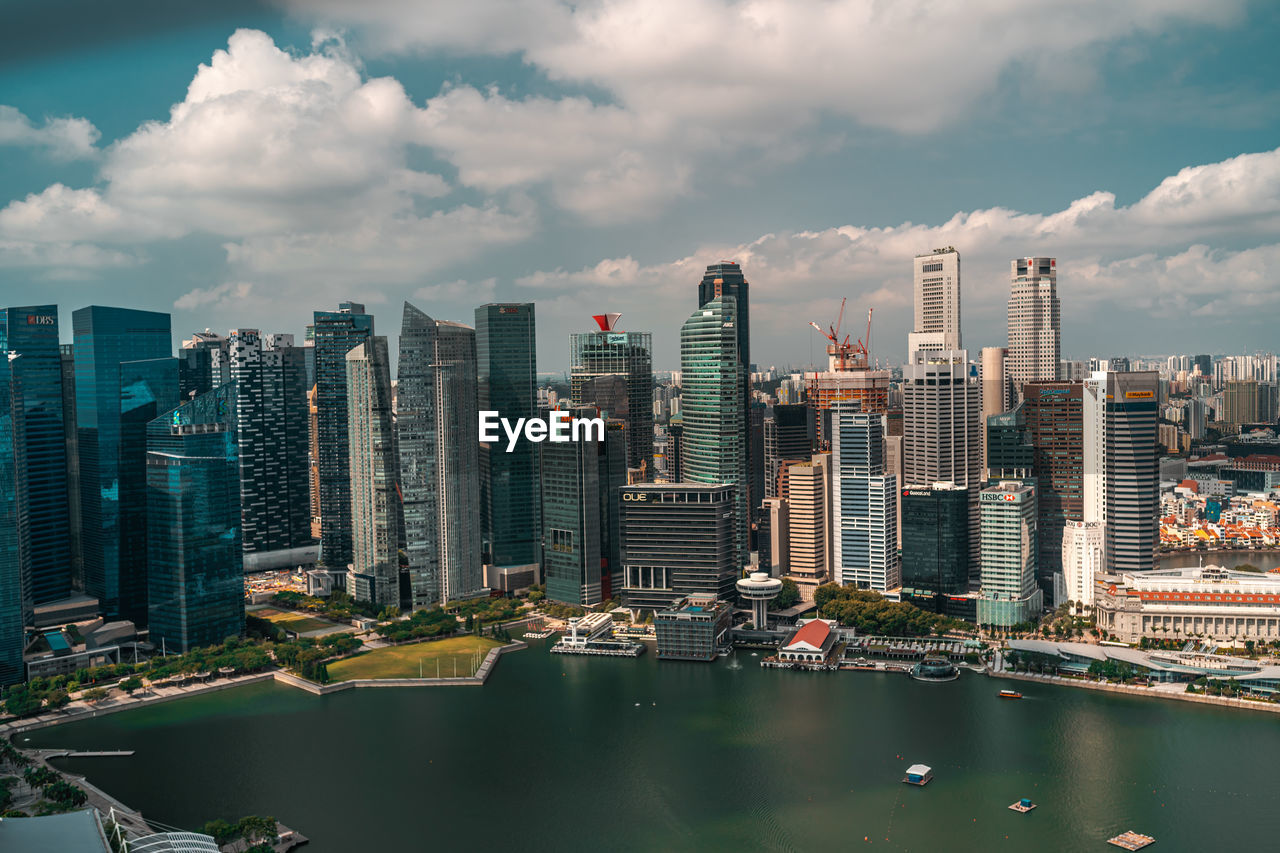 Modern buildings in city against sky in singapore