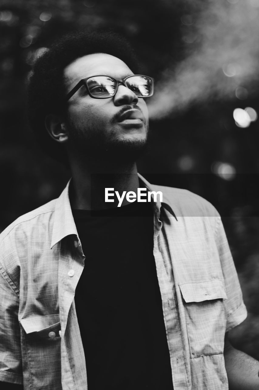 Portrait of young man looking away