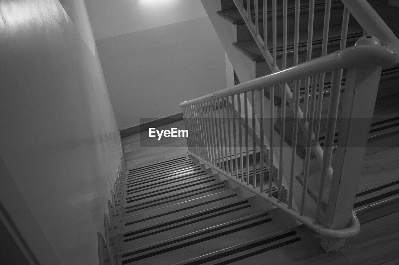 HIGH ANGLE VIEW OF SPIRAL STAIRCASE AT BUILDING