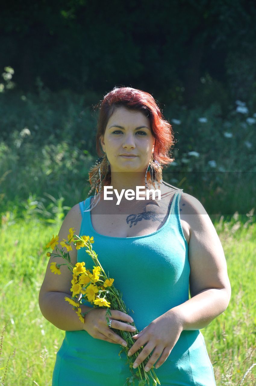 Woman in a meadow with flowers