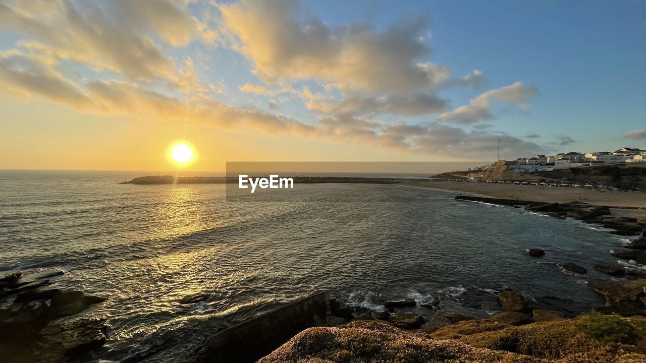 SCENIC VIEW OF SEA DURING SUNSET