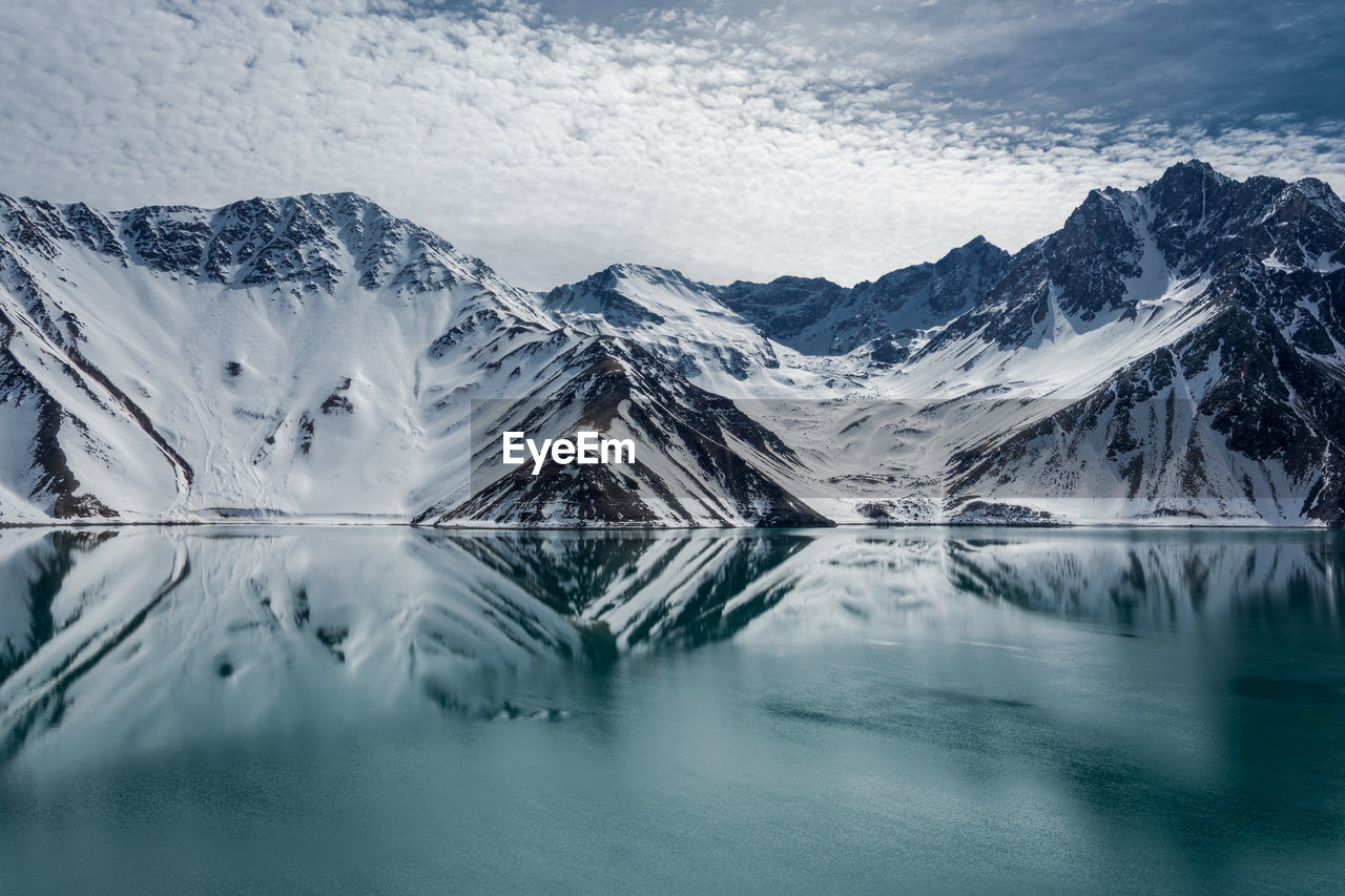 Scenic view of lake and snowcapped mountains