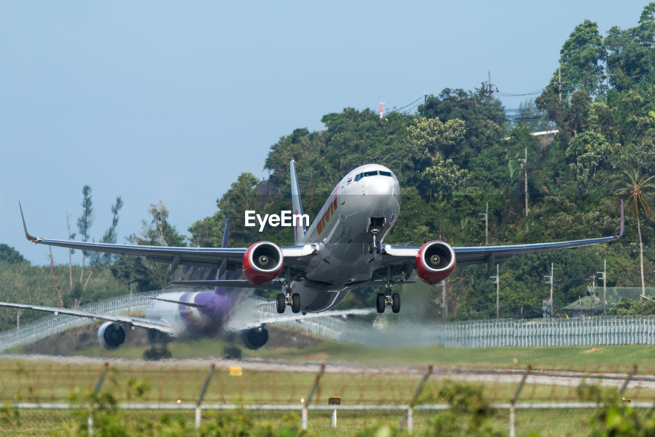 AIRPLANE FLYING IN SKY