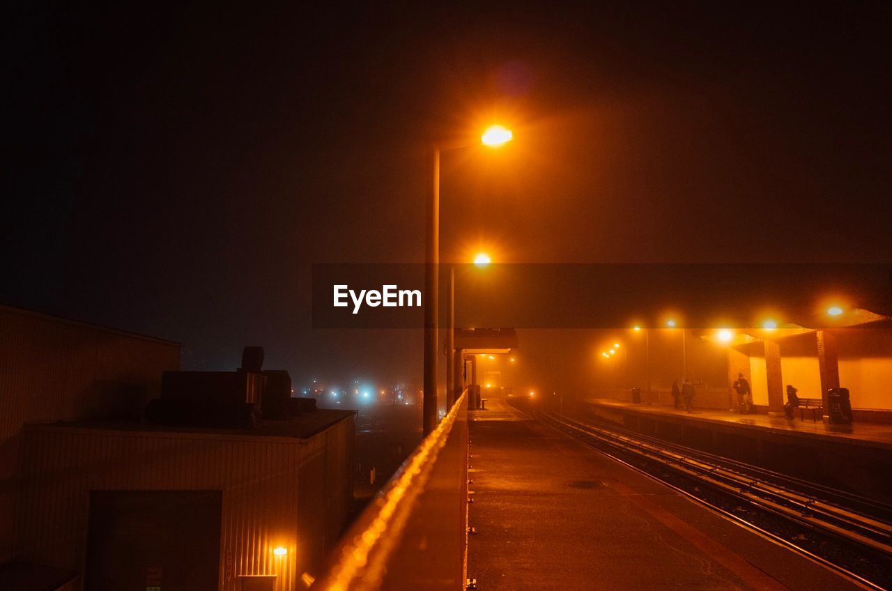 Illuminated street lights at night