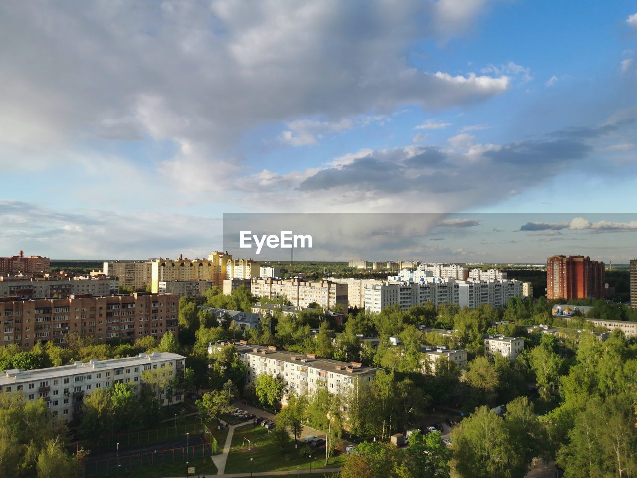 High angle view of trees and buildings against sky