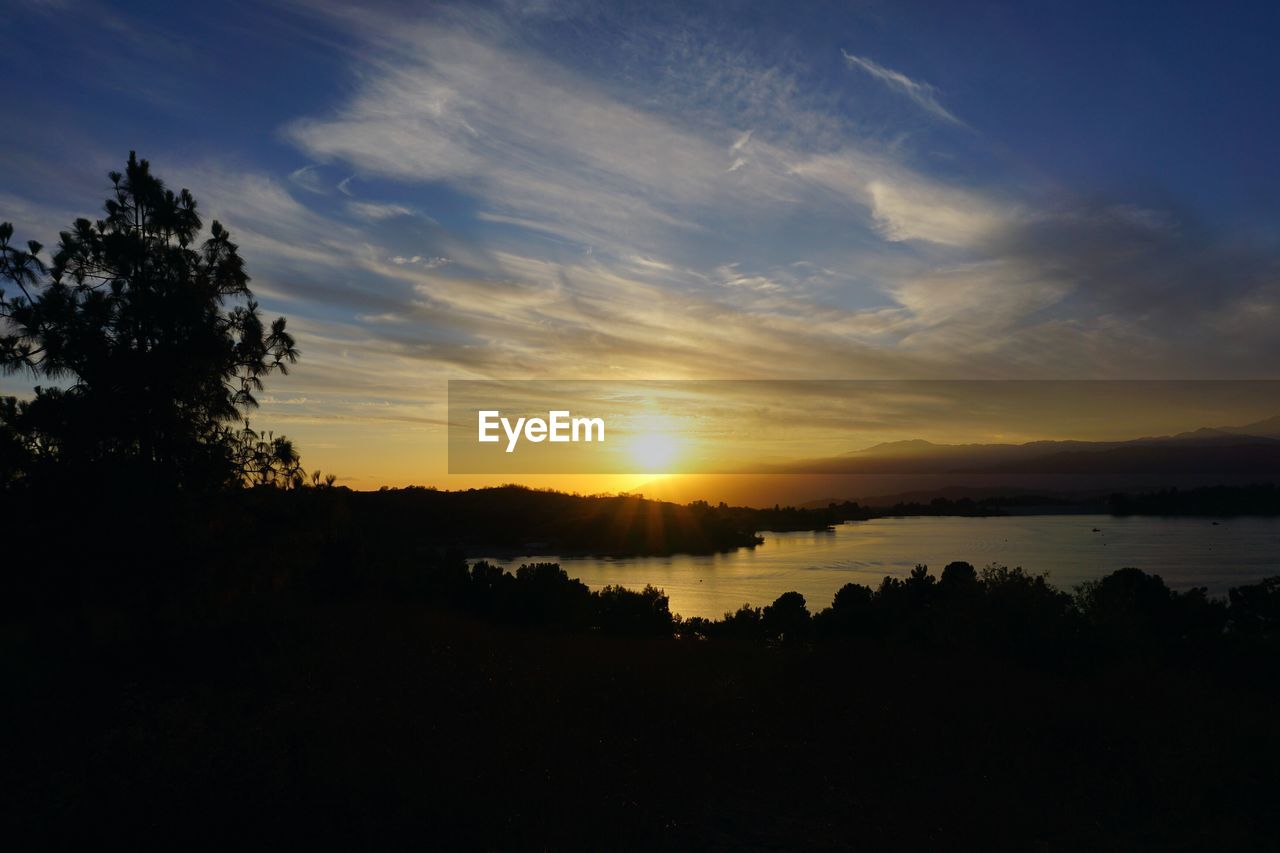 SCENIC VIEW OF SUNSET OVER SEA