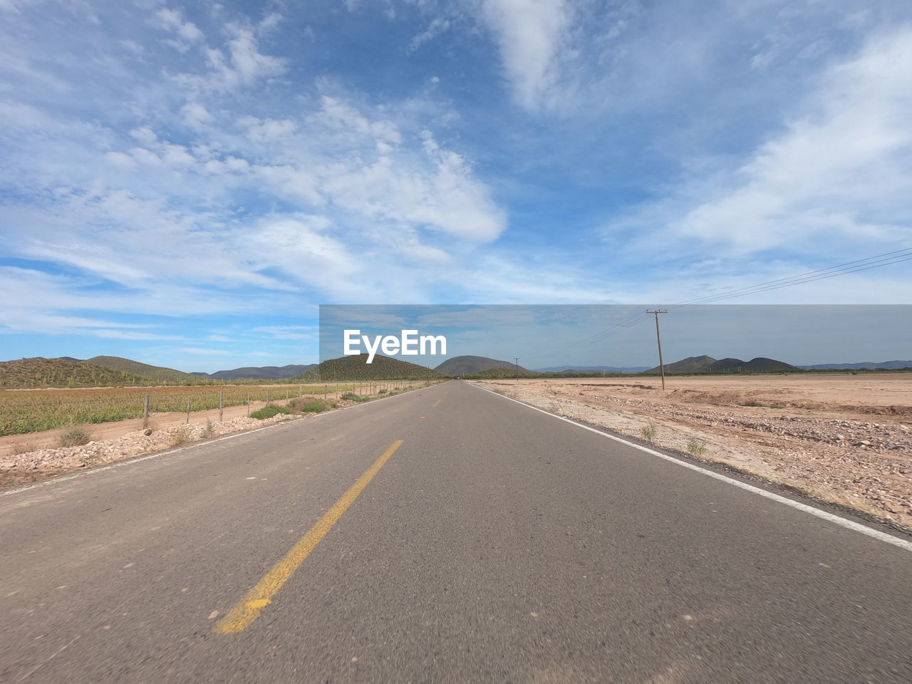 EMPTY ROAD AGAINST SKY