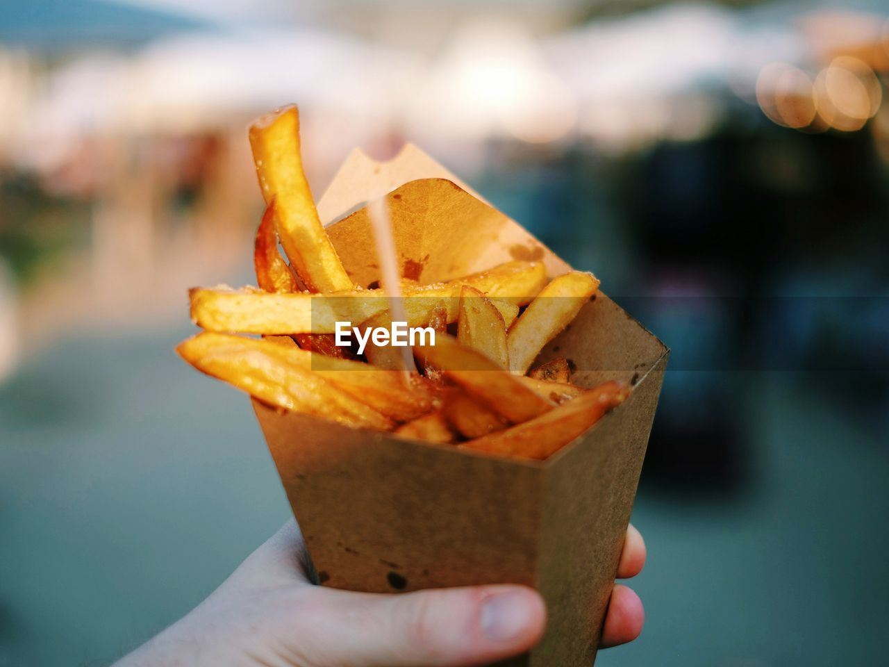 Close-up of hand holding chips