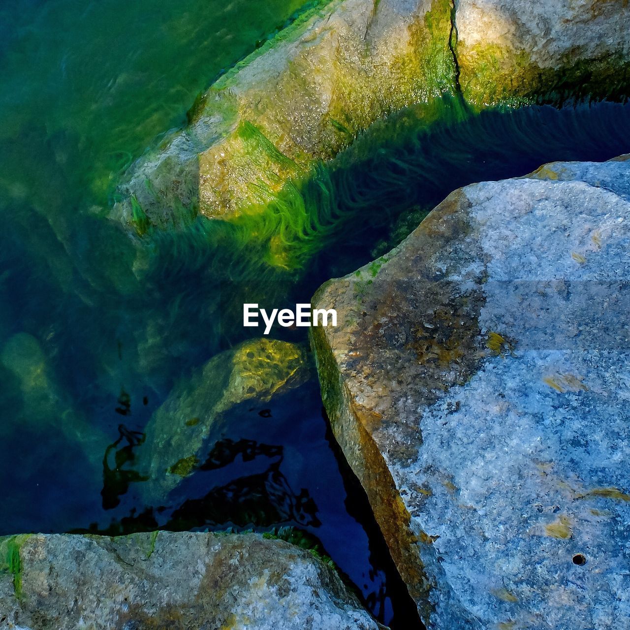 STREAM FLOWING THROUGH ROCKS