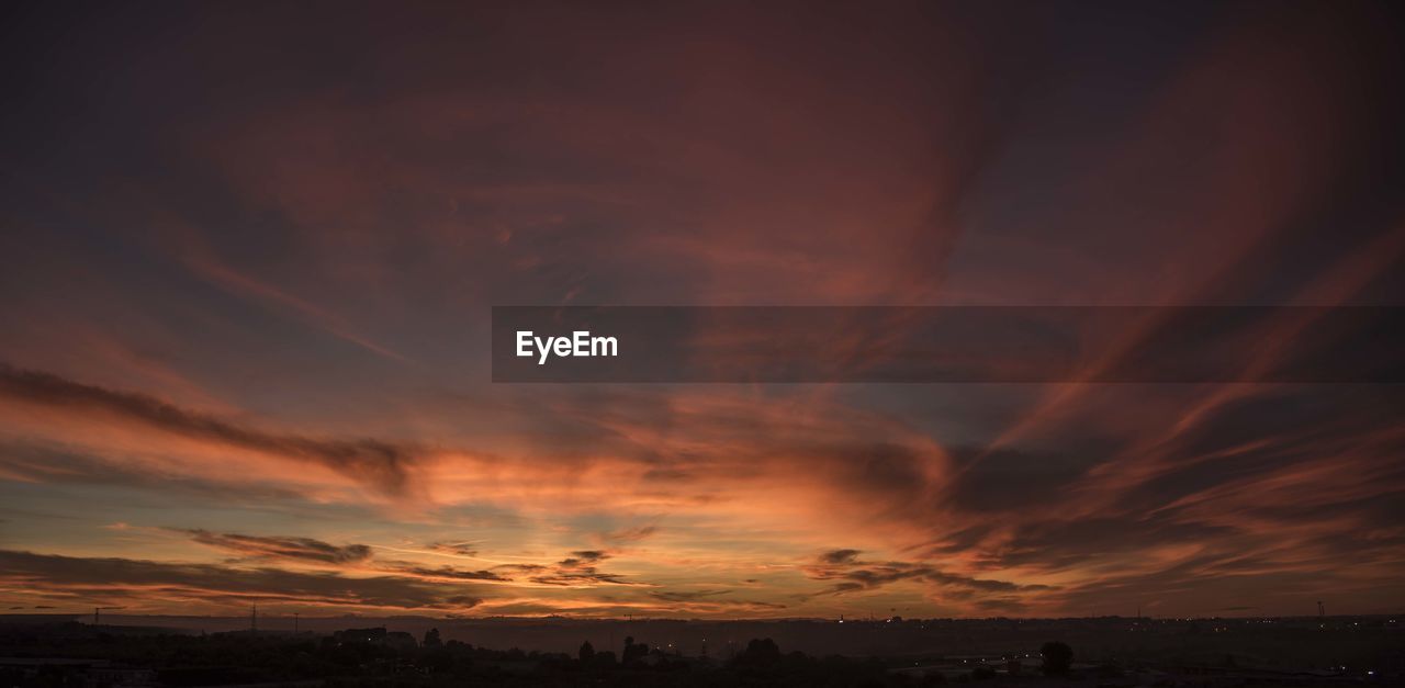 Scenic view of dramatic sky during sunset